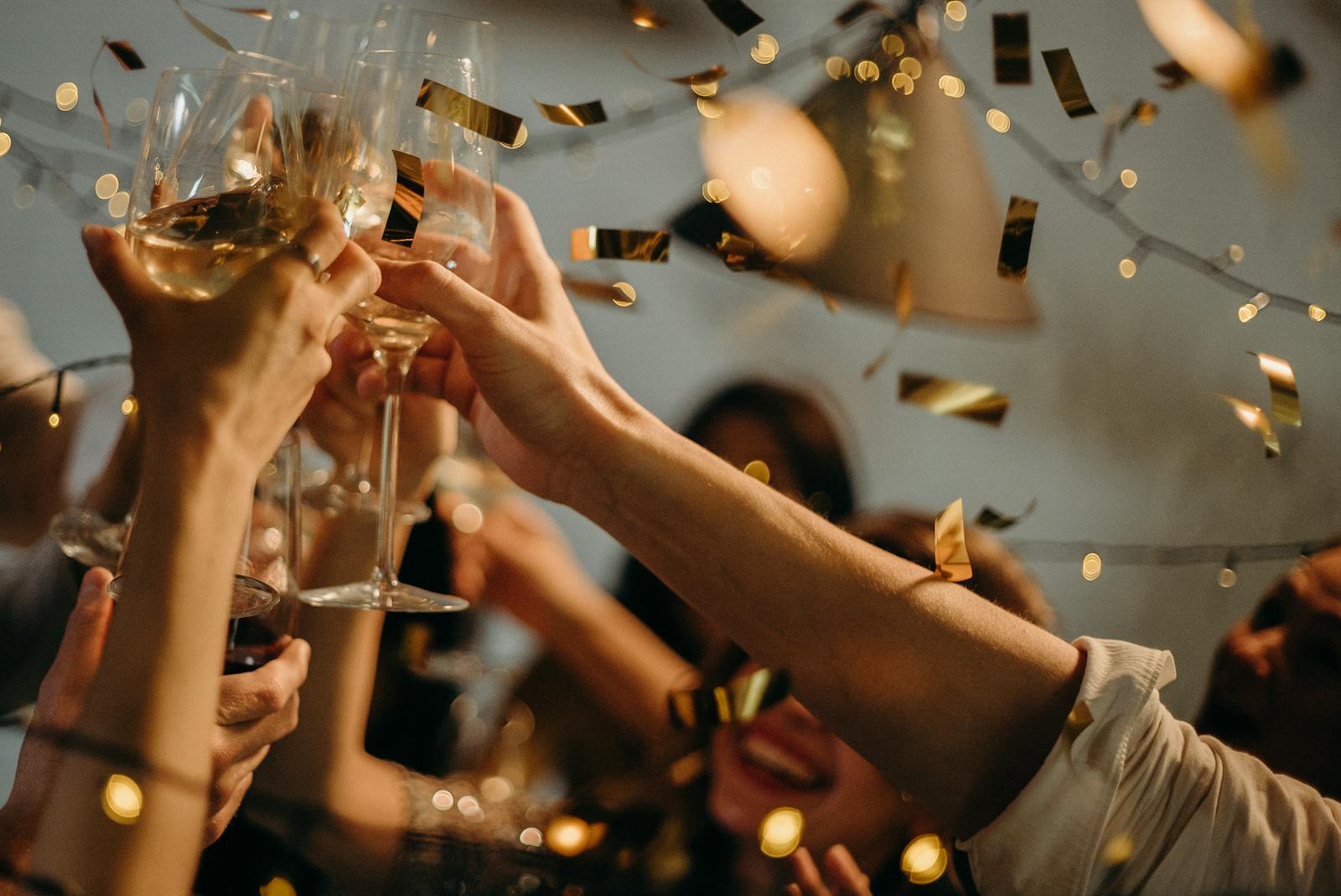 Crowd dancing on packed dance floor at wedding reception